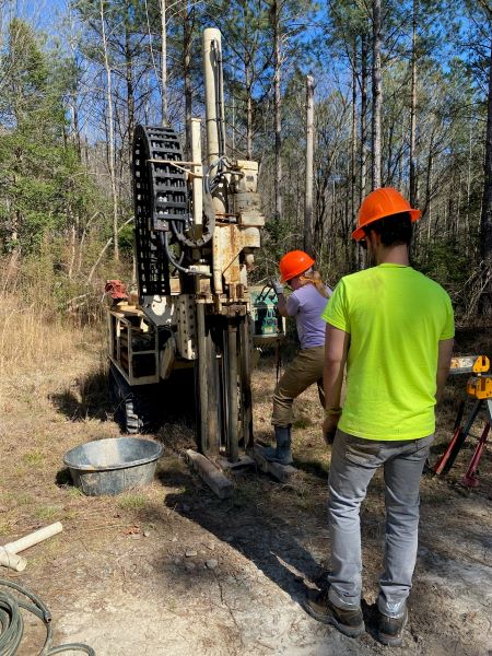 Geologists collecting core samples from within an Earth MRI project area